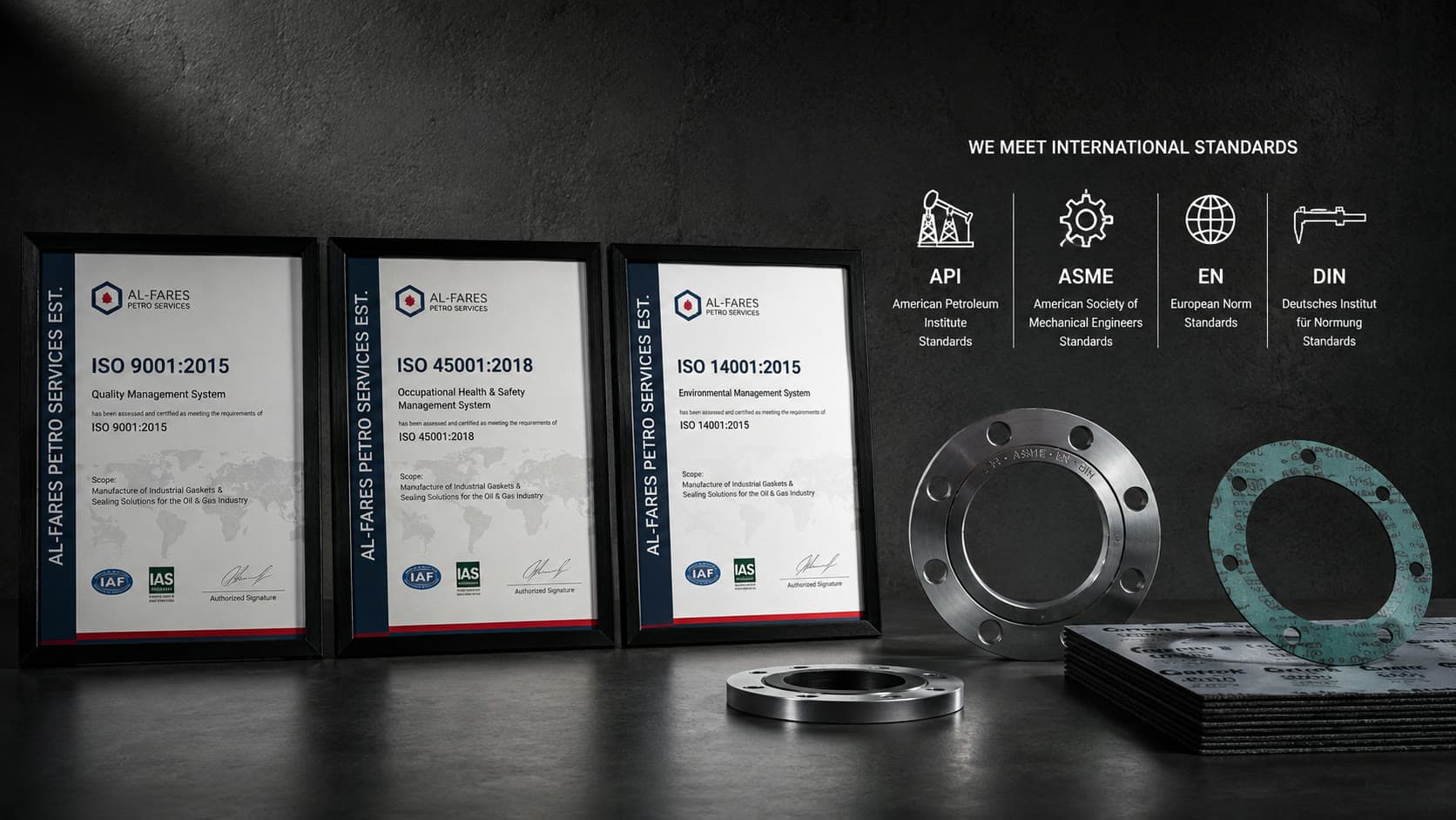 The framed ISO 9001, ISO 45001 and ISO 14001 certificates beside flanges and gasket sheet